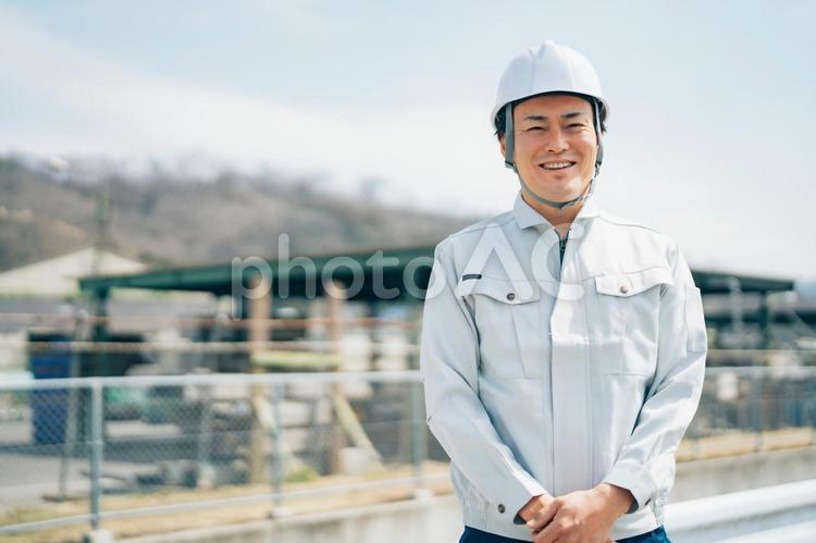 足場工事・建築業・作業着を着た男性 足場,足場職人,解体業の写真素材