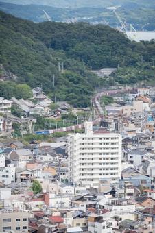 Train and cityscape, JPG