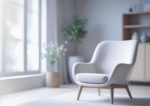 明るい日差しのアームチェアのある室内の写真