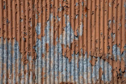 錆びて塗装が剥がれたトタン壁のテクスチャ 錆び,トタン,壁の写真素材