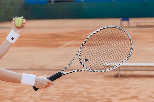 リストバンドをした手元 テニス,ラケット,ボールの写真素材