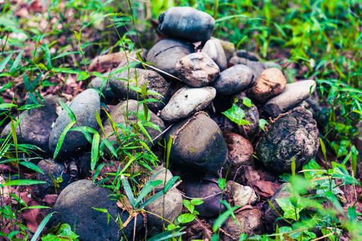 Pebbles piled up in the forest, JPG