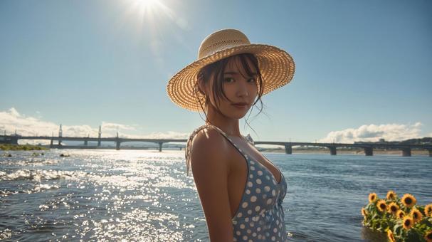 河原でストローハットとワンピースの女性 河原でストローハットとワンピースの女性の写真