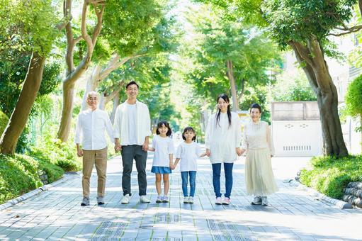 3 generation family holding hands, education, fresh green, sunny, JPG