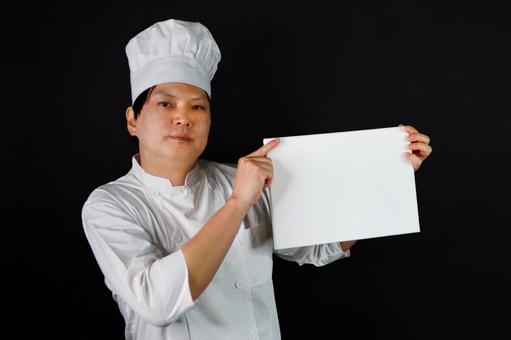 白いボードを持つ料理人 白いボードを持つ料理人 料理人,シェフ,コック帽の写真素材