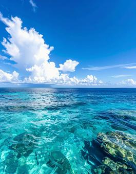 エメラルドの誘い:穏やかな海と広がる青空 エメラルドの誘い:穏やかな海と広がる青空の写真