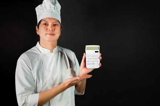 電卓を持つ料理人 料理人,電卓,白衣の写真素材