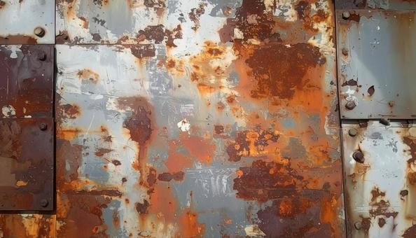 サビで朽ちた金属の背景 サビで朽ちた金属の背景の写真