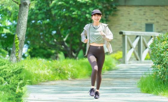 スポーツの秋・ジョギングをする女性 スポーツの秋・ジョギングをする女性 女性,運動,スポーツの写真素材