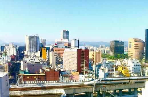 小倉駅北側から新幹線と街並を望む 鉄道,新幹線,山陽新幹線の写真素材