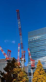 高層ビル工事のクレーン 工事,工事現場,クレーンの写真素材