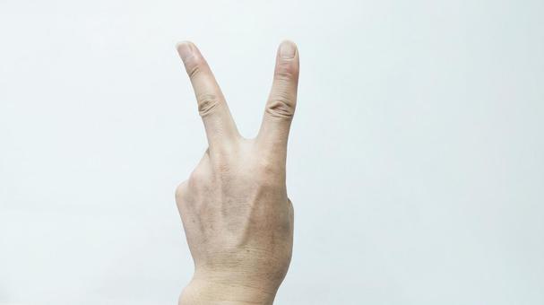 左手でピースサインの手素材 ピース,二本の指,人差し指の写真素材