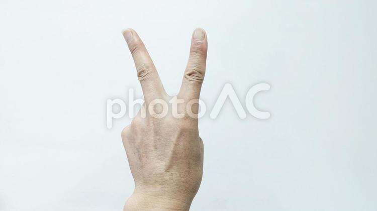 左手でピースサインの手素材 ピース,二本の指,人差し指の写真素材