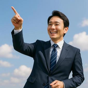 未来を指し示すビジネスマン 未来を指し示すビジネスマンの写真