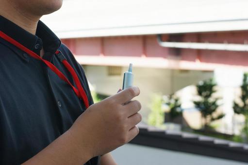 電子タバコ　サラリーマンの休憩 電子タバコ,休憩,一息の写真素材