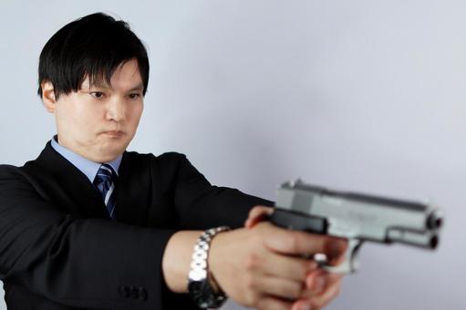 銃を構えるビジネスマン ビジネスマン,男性,銃の写真素材