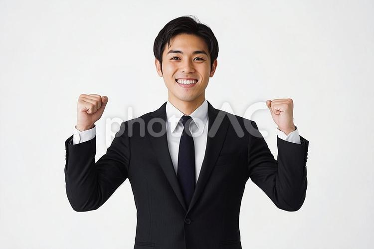 ガッツポーズをする若いさわやか男性社員 ビジネス,スーツ,男性の写真素材