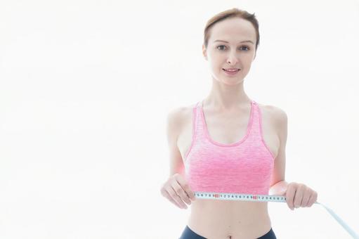 ダイエットをする若い女性 ダイエットをする若い女性 ジム,ボディライン,メンテナンスの写真素材