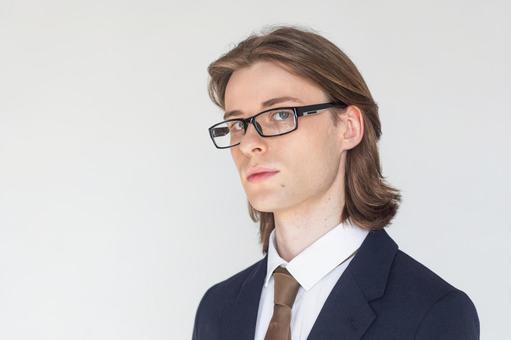 カメラ目線でメガネをかけたスーツの男性 男性,外国人,欧米人の写真素材