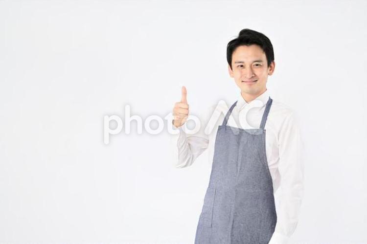 エプロンをつけた男性 飲食店,スタッフ,店員の写真素材