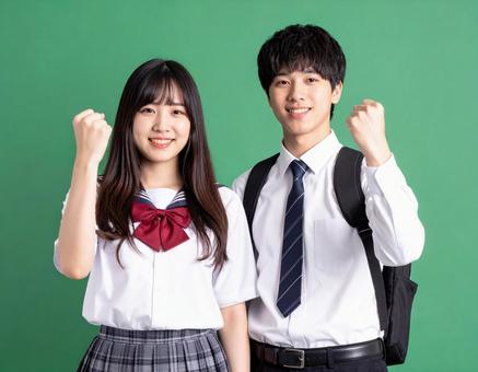 ポーズを決める高校生男女 グリーンバック ポーズを決める高校生男女 グリーンバックの写真