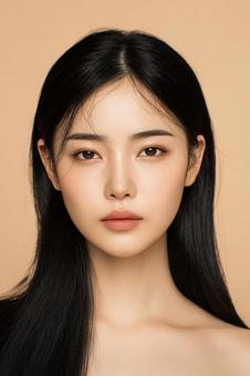 ベージュ背景のクールな韓国人女性 ベージュ背景のクールな韓国人女性の写真