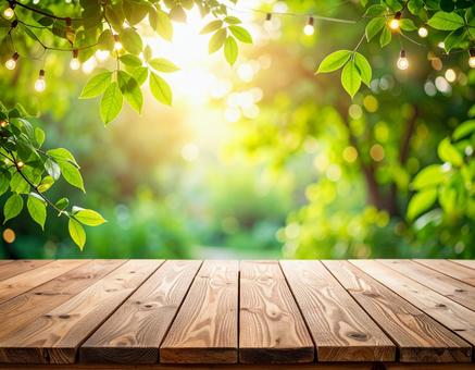 木のテーブルと緑のガーデン風景の写真