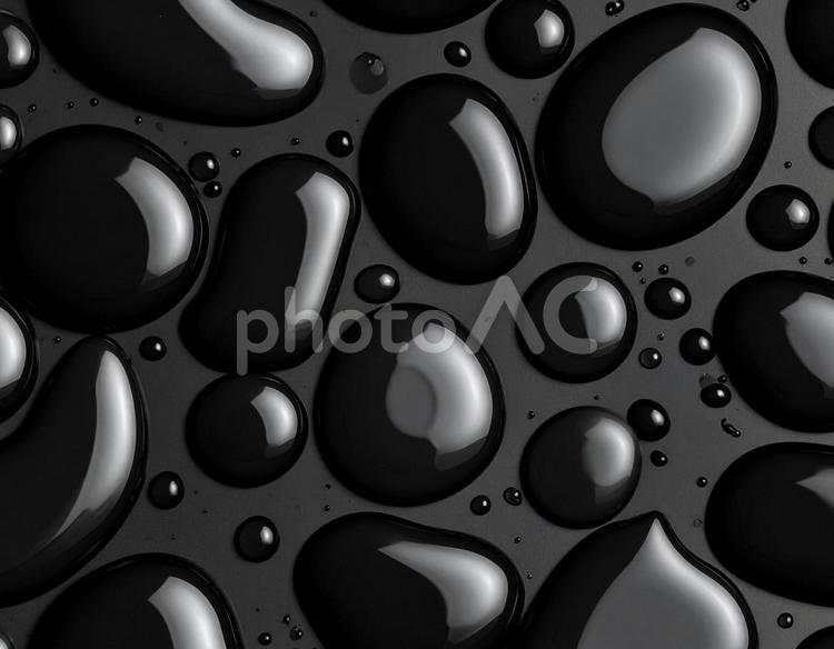 黒いワックスのしずくと抽象模様 ワックス,黒,しずくの写真素材