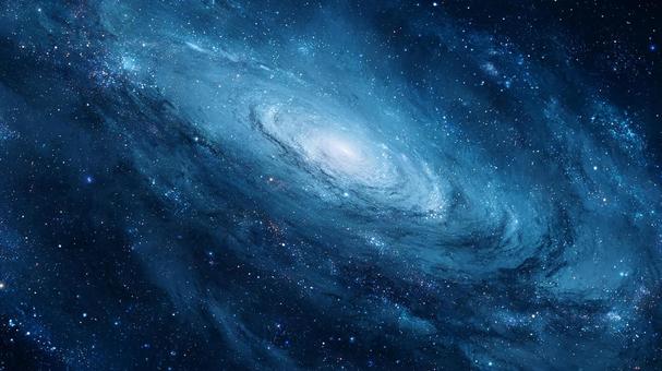 暗闇に浮かび上がる青い光の銀河の写真
