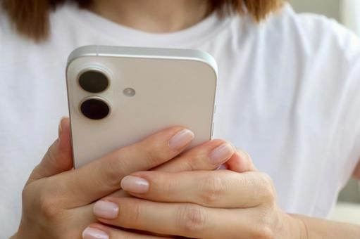 Woman's hand holding a smartphone, JPG Woman's hand holding a smartphone, JPG