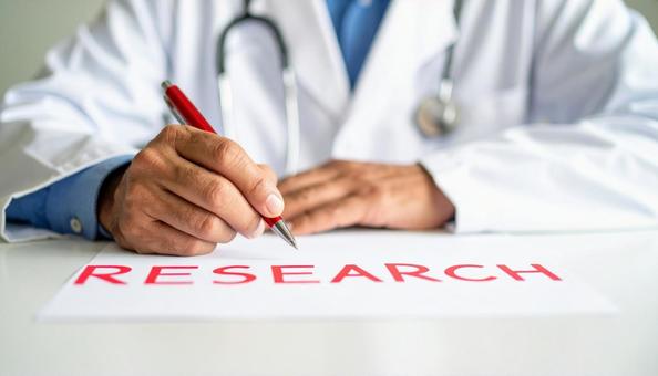 研究「Research」と書く白衣の男性 研究「Research」と書く白衣の男性の写真