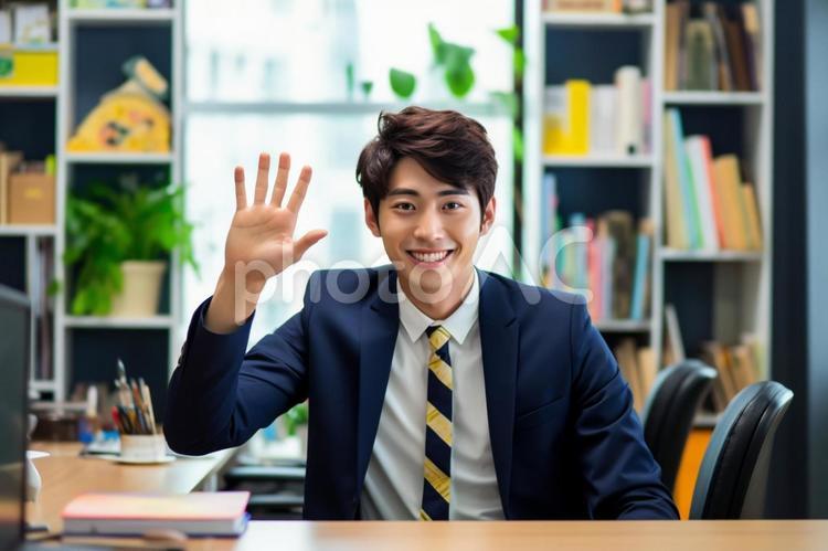 手を振る男性会社員 男性,サラリーマン,スーツの写真素材