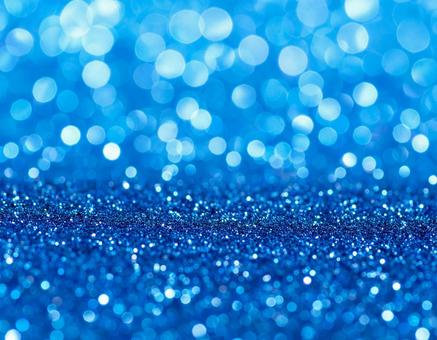 ブルーのラメ　キラキラ　背景素材1の写真