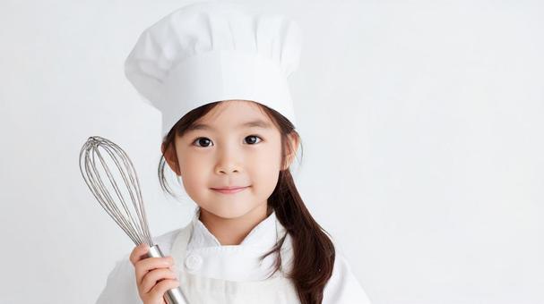 パティシエの格好をした女の子の写真