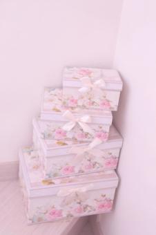 Pretty rose-patterned boxes stacked on the landing, JPG