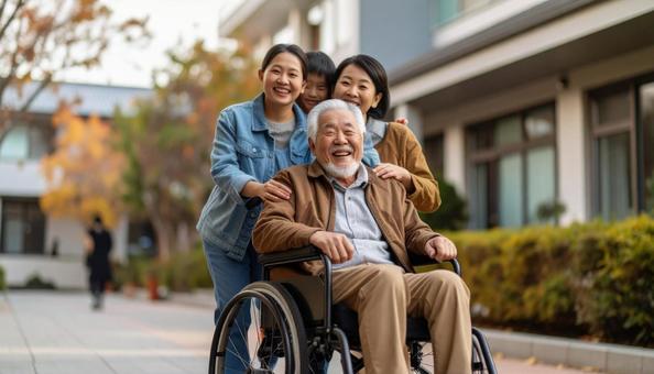 介護施設のシニア男性と見舞いに来た家族の写真