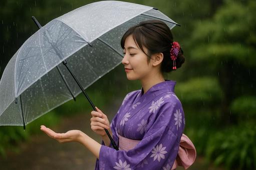 雨粒を受ける浴衣の女性 雨粒を受ける浴衣の女性の写真