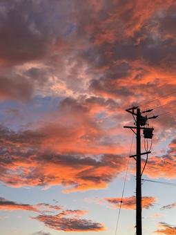 Dramatic sunset clouds and the silhouette of power lines, JPG Dramatic sunset clouds and the silhouette of power lines, JPG