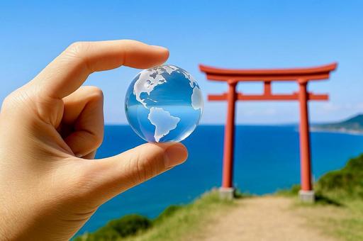 日本の鳥居とガラスの地球の写真