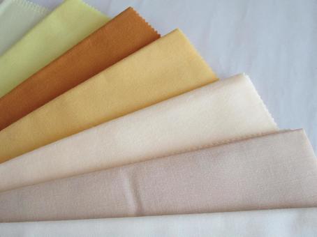 Colored drapes (colored fabrics) in yellow and brown tones, JPG
