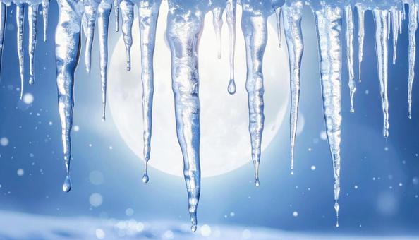 凍てつく月夜に輝くつららの写真