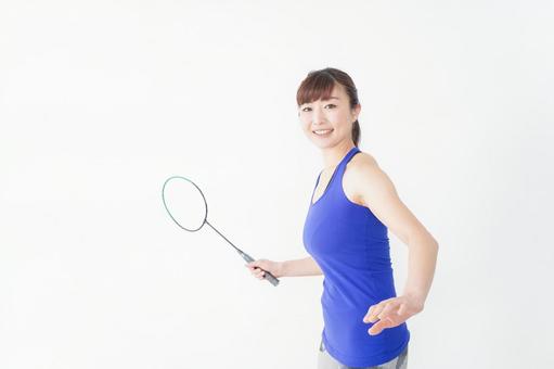 ラケットを持つ若い女性 ラケットを持つ若い女性 白背景,運動着,スポーツ選手の写真素材