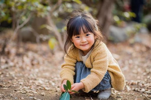 落ち葉を拾う女の子-2 落ち葉を拾う女の子-2の写真