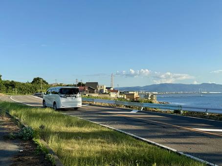 日本海沿いの道路 福井県 東尋坊手前 日本海沿いの道路 福井県 東尋坊手前 日本海,水平線,道路の写真素材