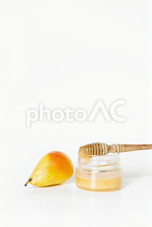 ハニーディッパーと洋梨と蜂蜜 蜂蜜,天然素材,保湿の写真素材