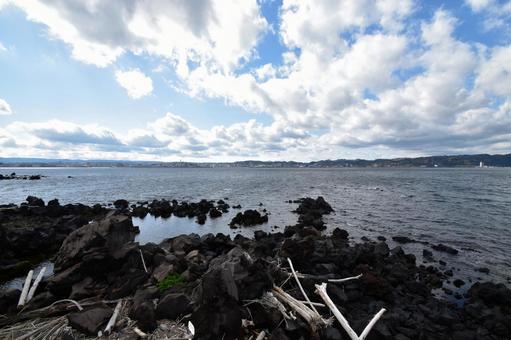 桜島火山と海岸線の黒い岩石地帯﻿ 桜島,火山,鹿児島の写真素材