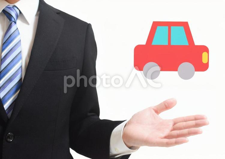 手を横に出すリクルートスーツと車 車,自動車,カーの写真素材
