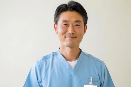 中年男性理学療法士の笑顔 中年男性理学療法士の笑顔の写真