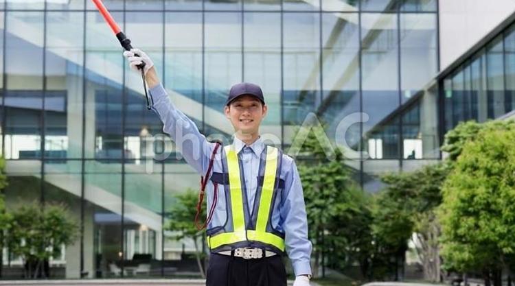 交通整理をする交通誘導員 交通誘導員,駐車場,案内の写真素材