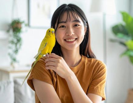 手乗りセキセイインコと彼女 手乗りセキセイインコと彼女の写真